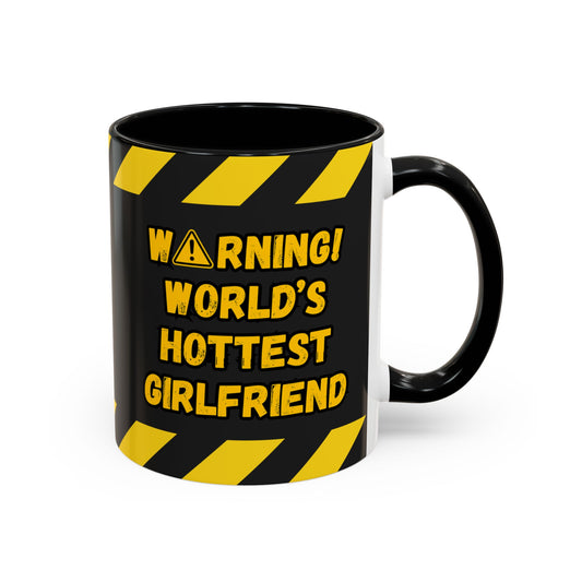 Black mug with yellow warning text on a white background