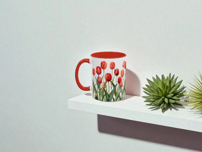 Red mug with tulip design on a white shelf against a light gray background