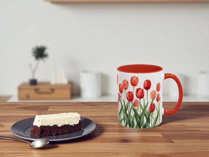 Mug with tulip design on a wooden table with a slice of cake