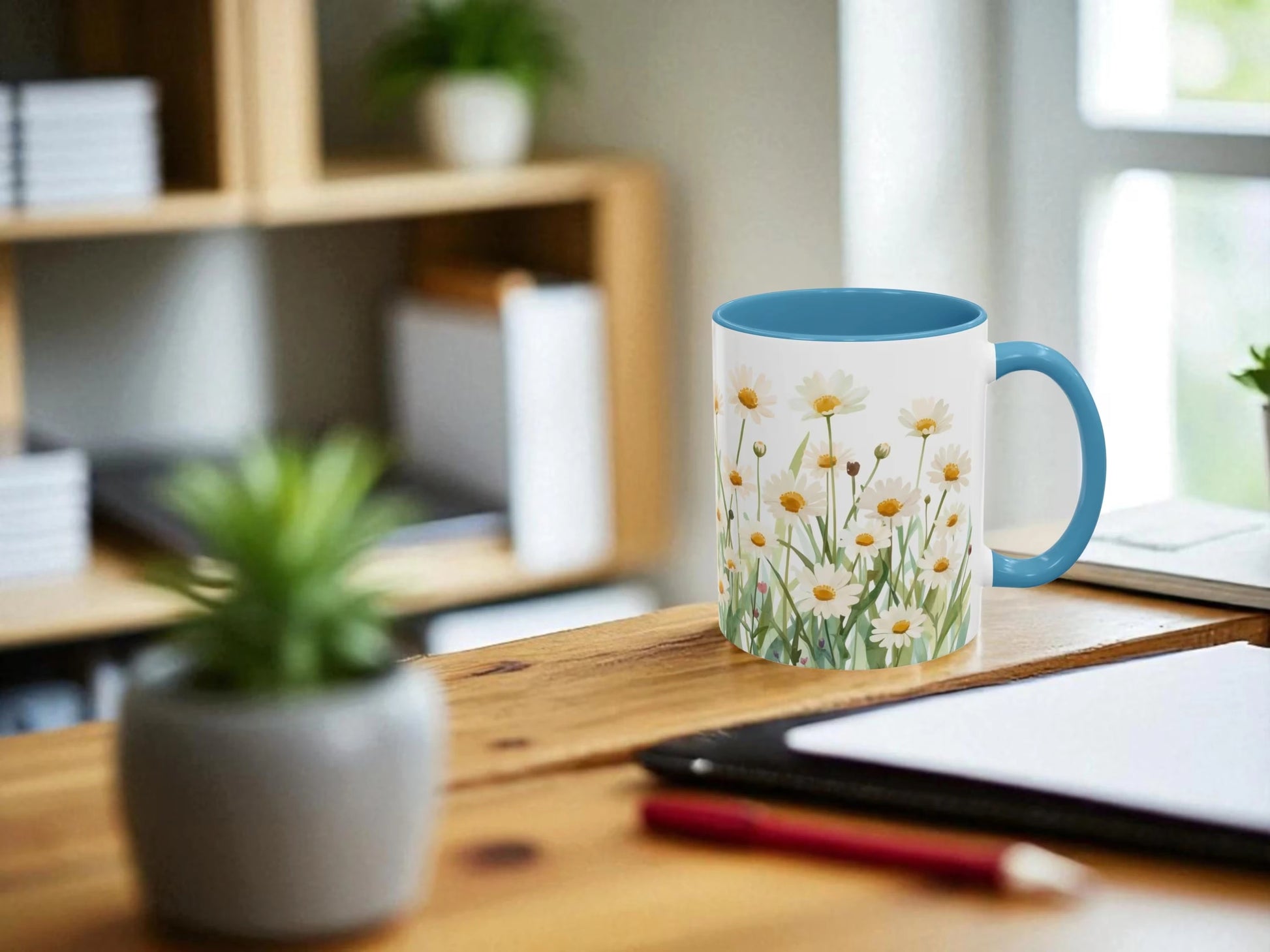 Mug with floral design on a desk with office items