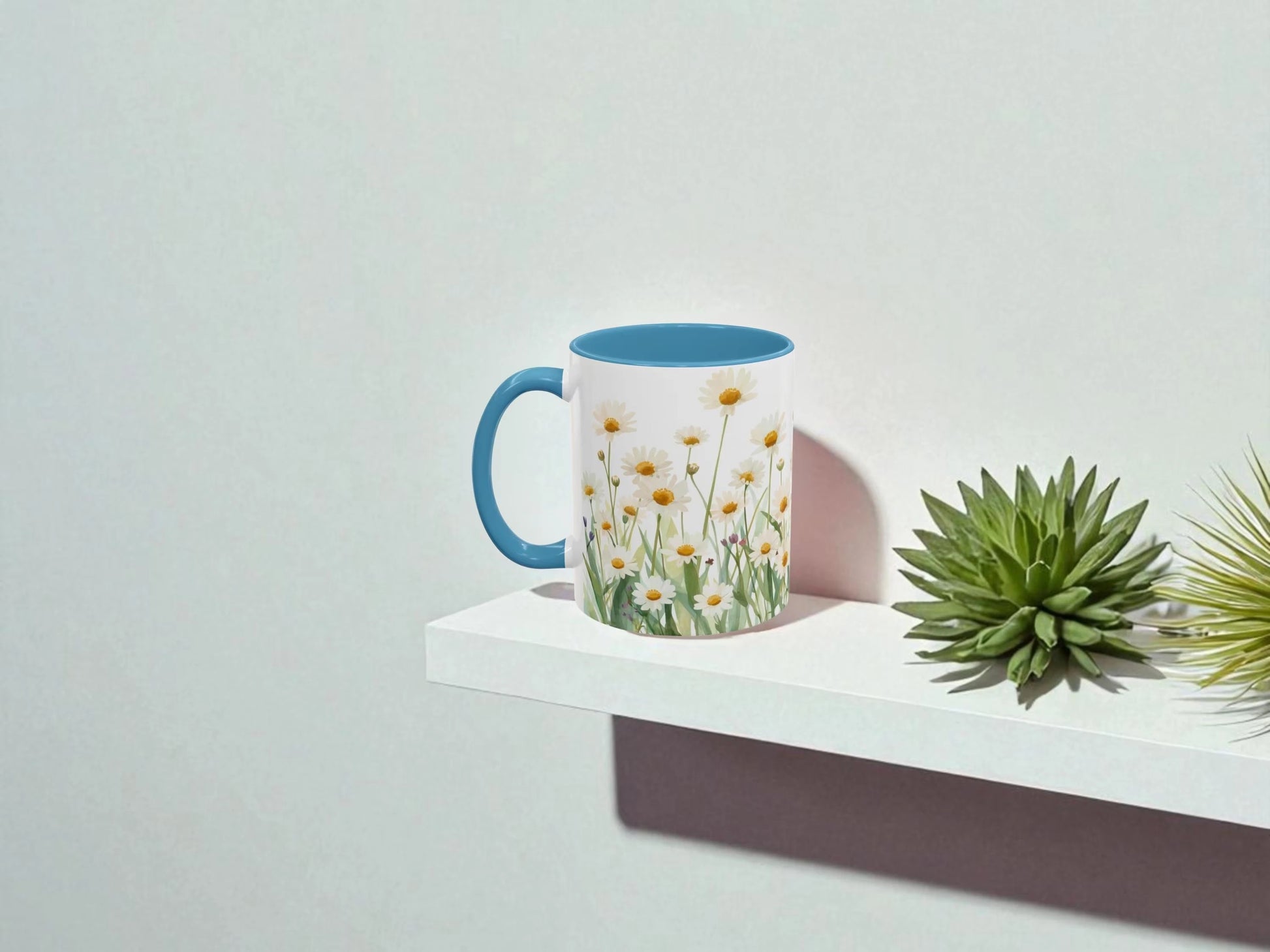 Mug with floral design on a white shelf against a light gray background