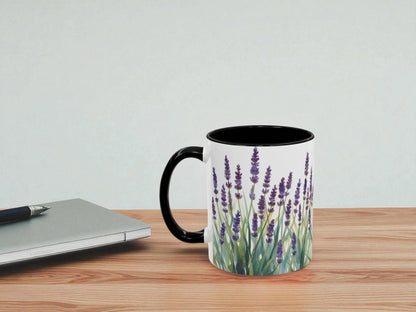 Mug with lavender design on a wooden table next to a laptop.