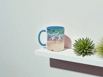 Colorful mug with beach design on a white surface with a plant