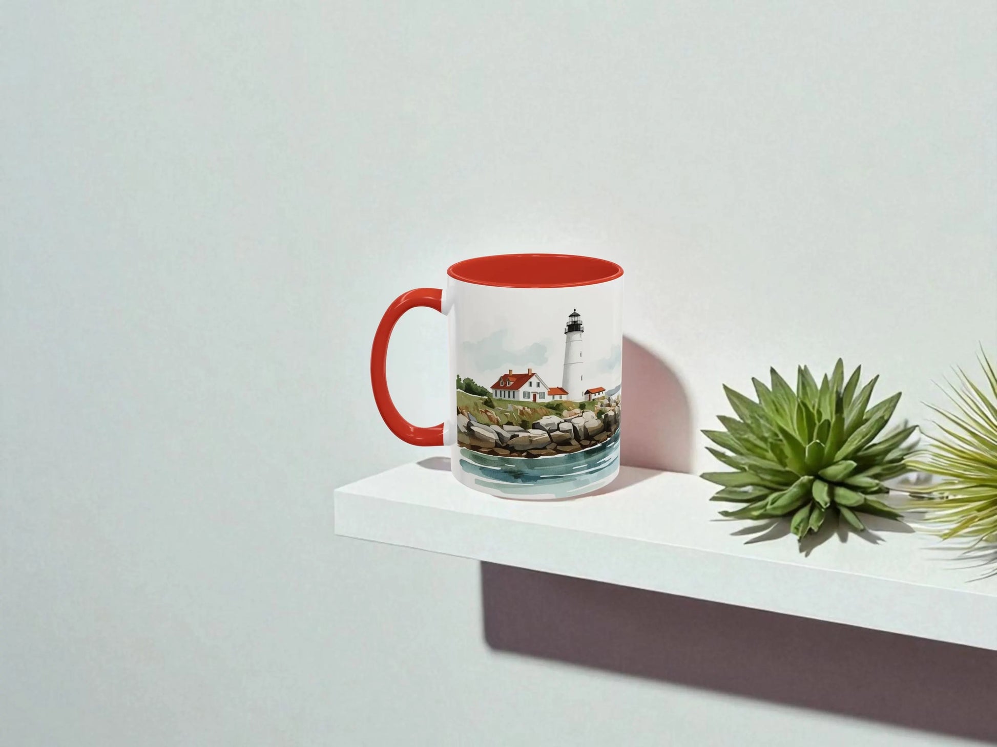 Mug with a scenic design on a white surface with a plant
