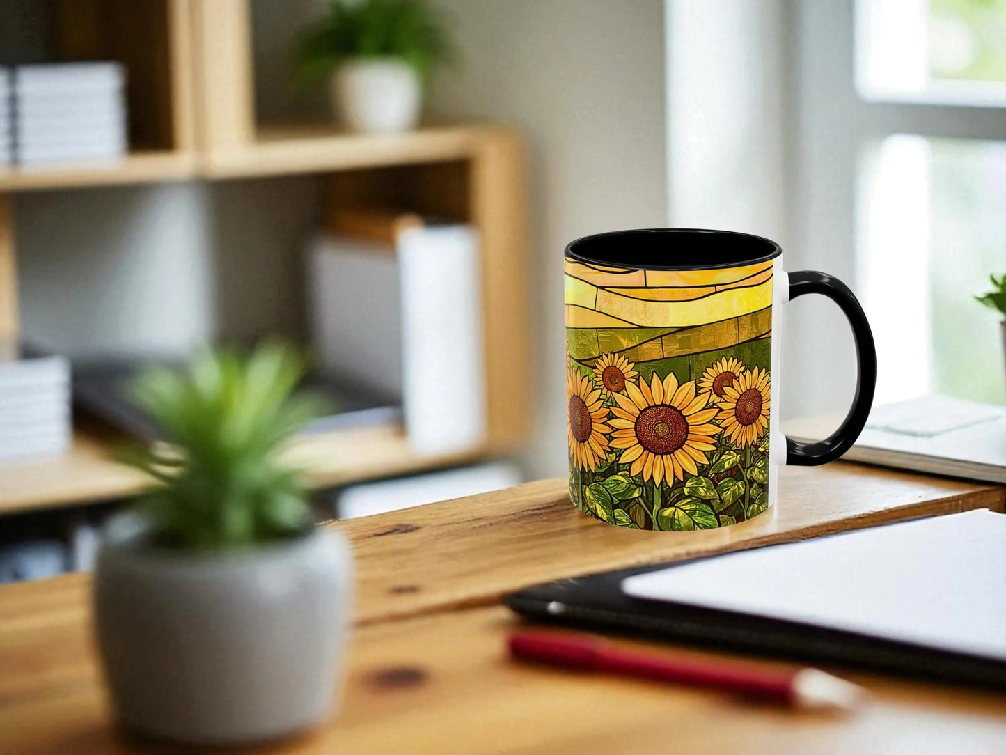 Decorative mug with sunflower design on a wooden desk