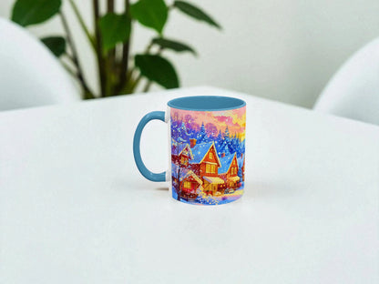 Colorful mug with a winter village design on a white surface.