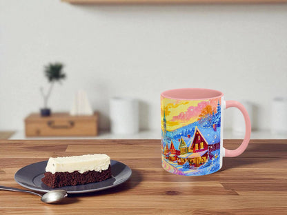 Colorful mug with a scenic design on a wooden table next to a slice of cake.
