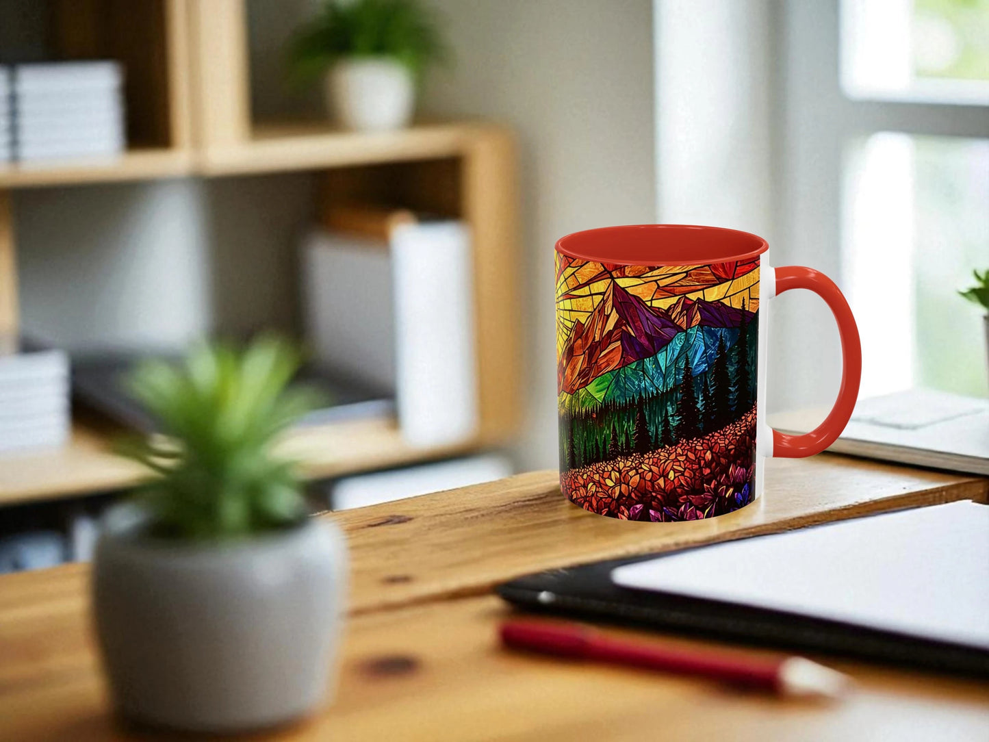 Colorful mug with mountain design on a wooden desk in a home office setting