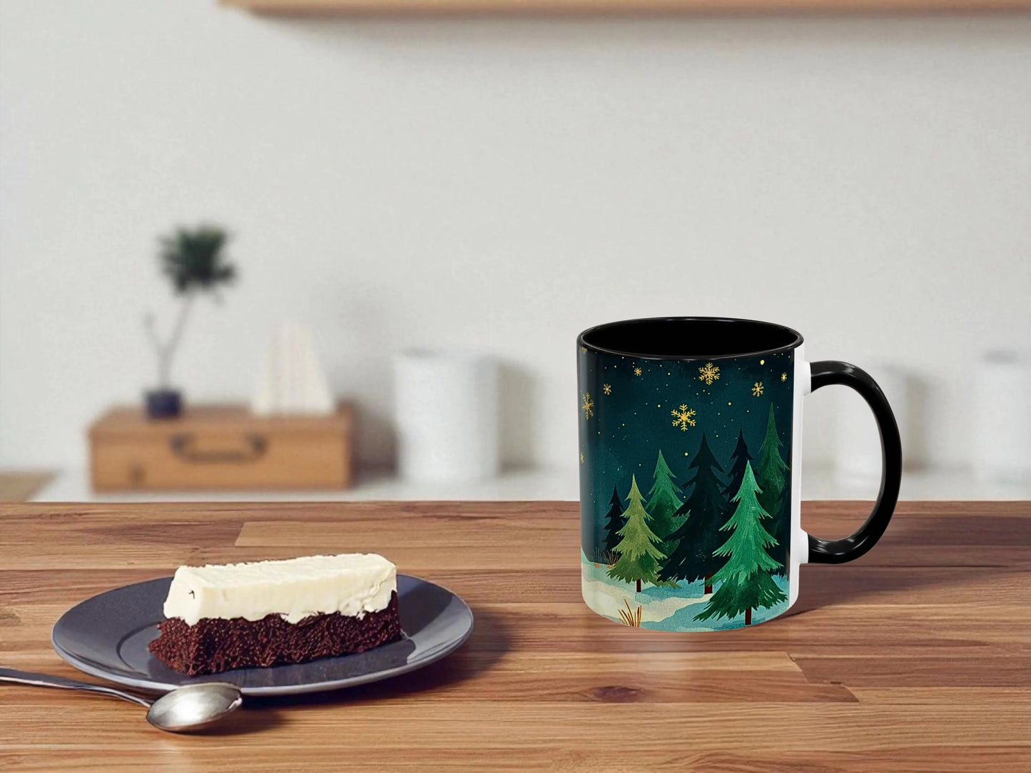 Mug with nature design on a wooden table next to a dessert