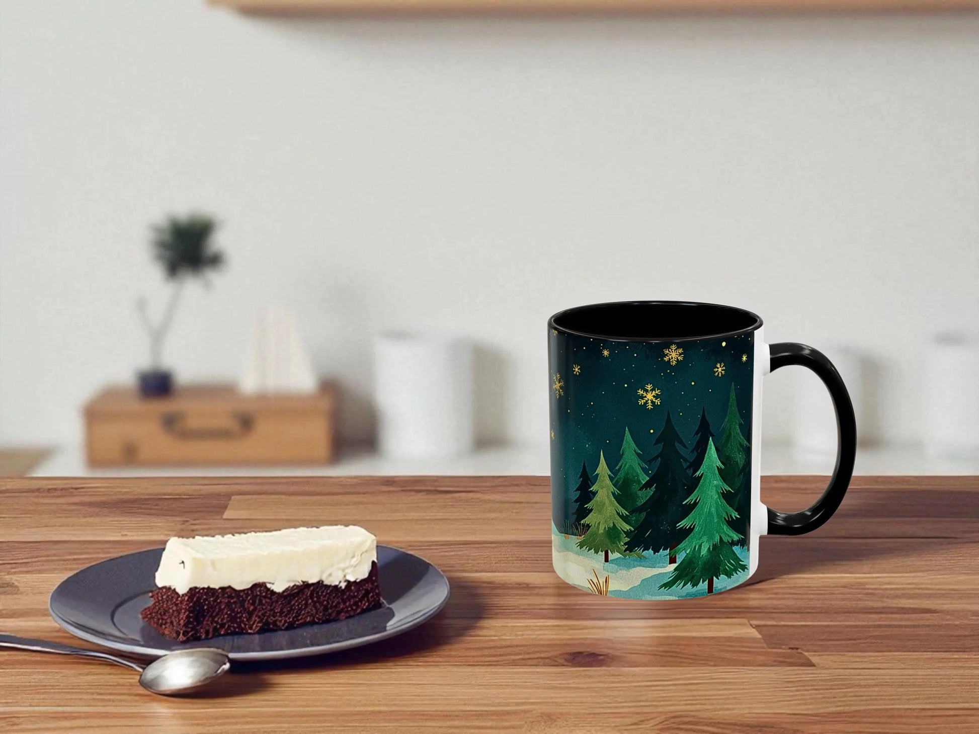 Mug with nature design on a wooden table next to a dessert