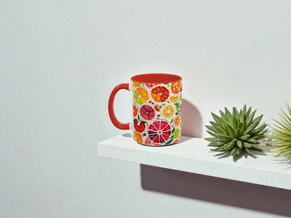 Colorful mug with fruit pattern on a white shelf against a light gray background