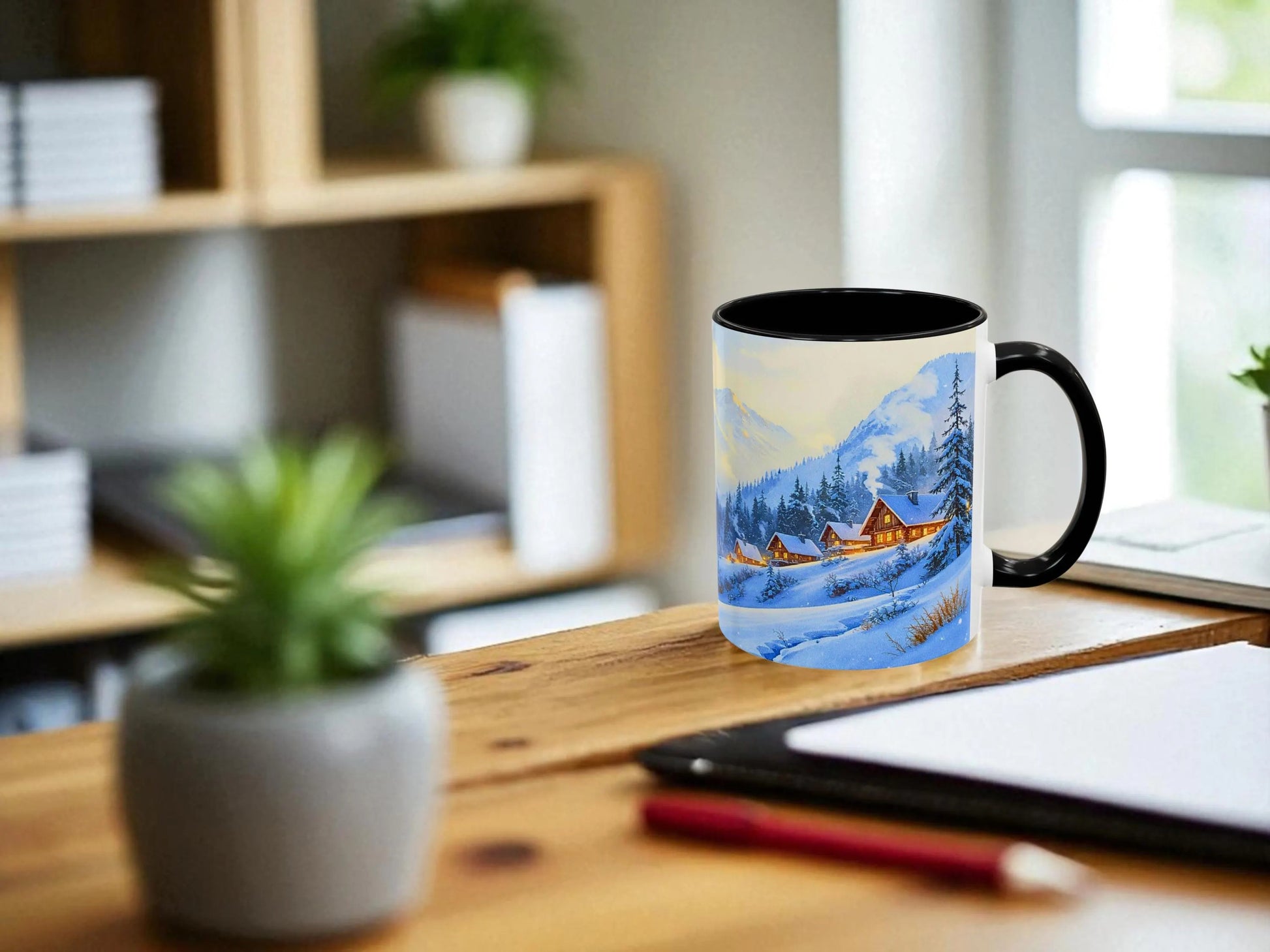 Mug with a scenic design on a wooden desk with office items.