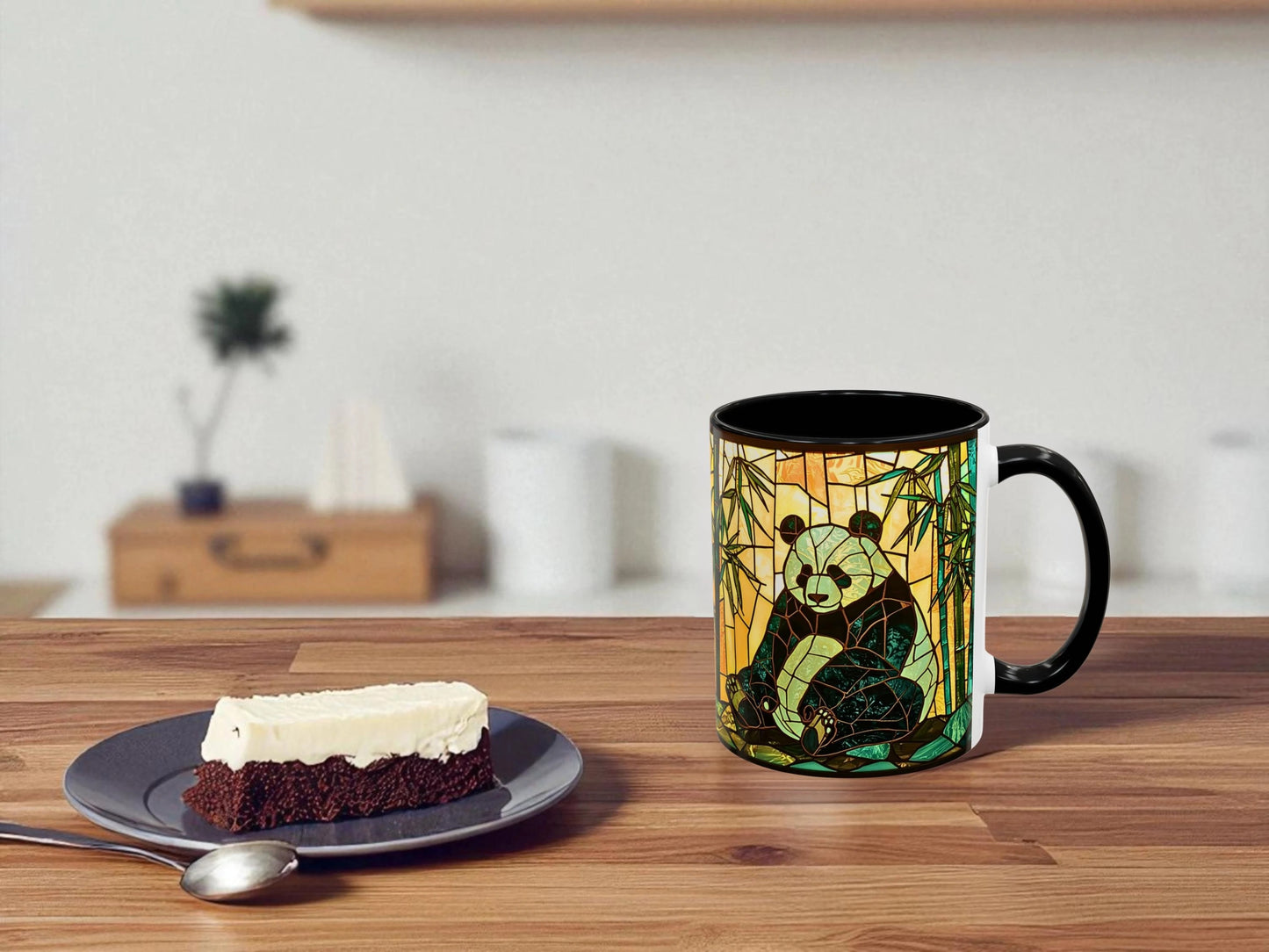 Mug with panda design on a wooden table with a slice of cake