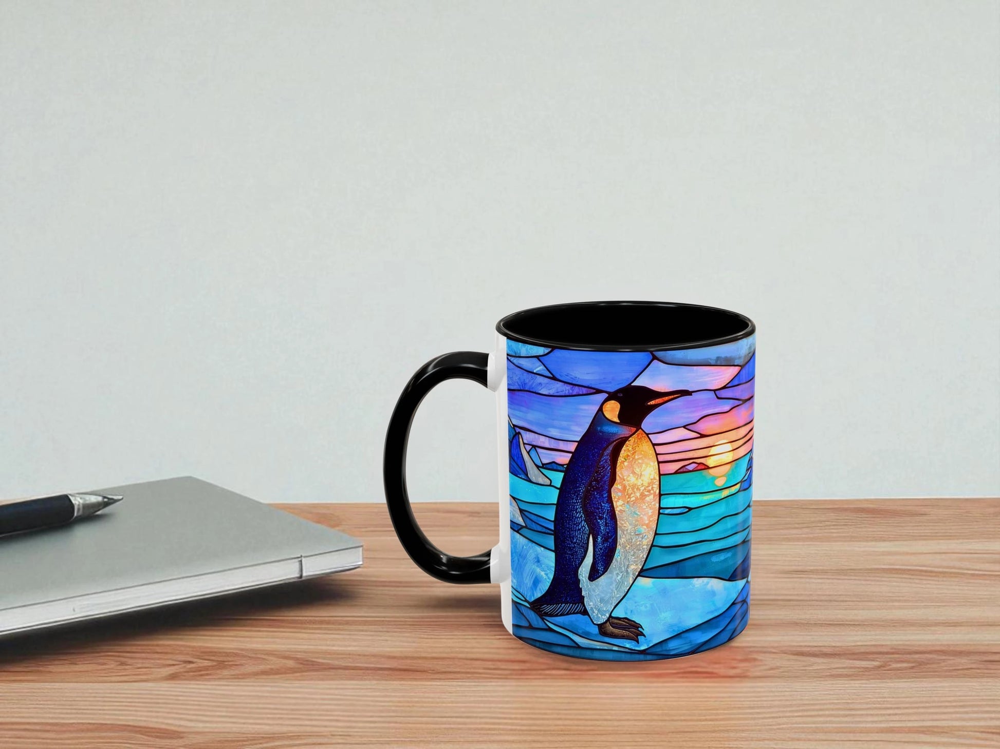 Mug with a penguin design on a wooden table with a light gray background