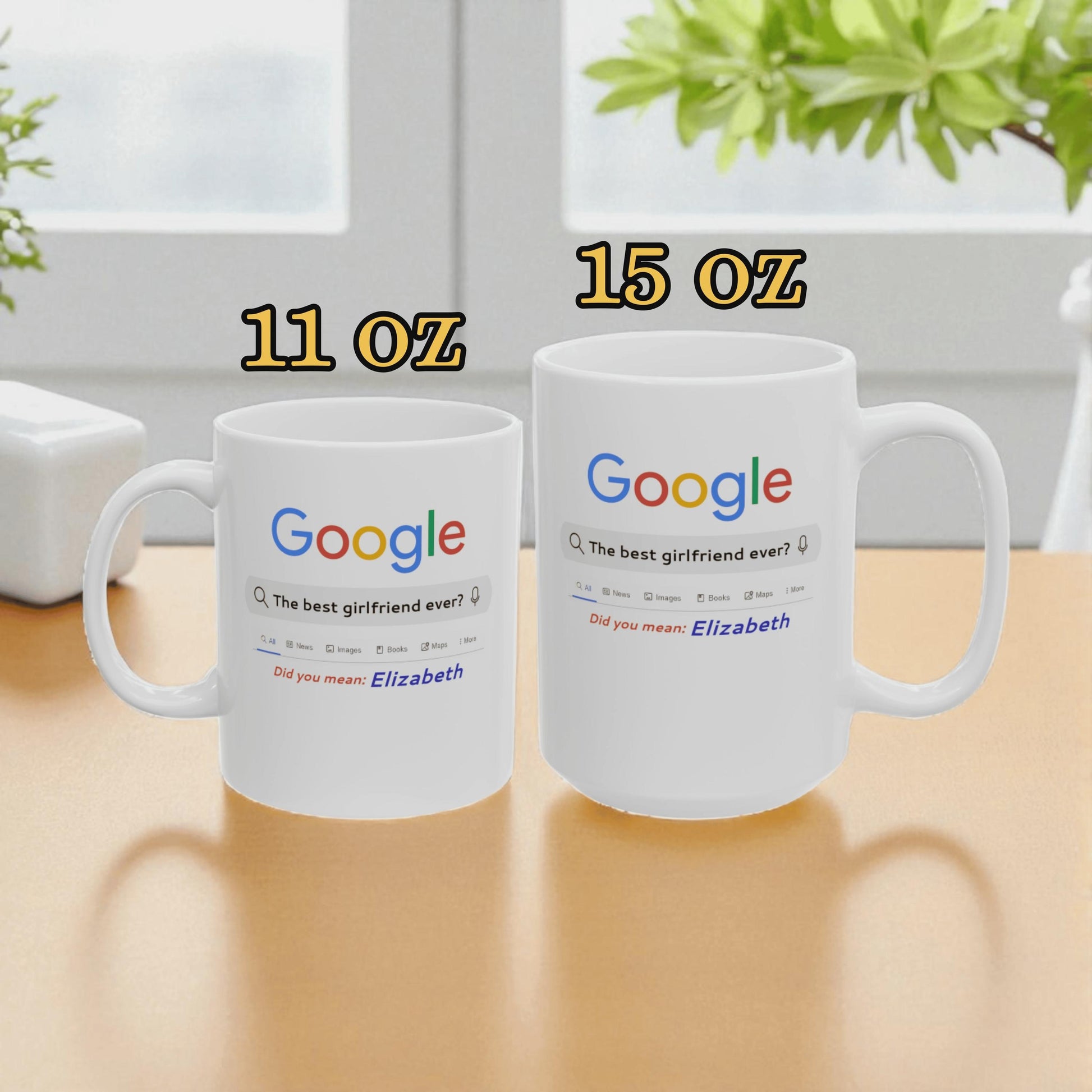 Two white mugs with Google logo and text on a wooden surface.