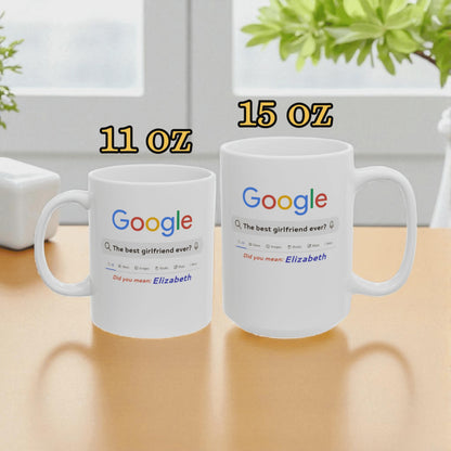 Two white mugs with Google logo and text on a wooden surface.