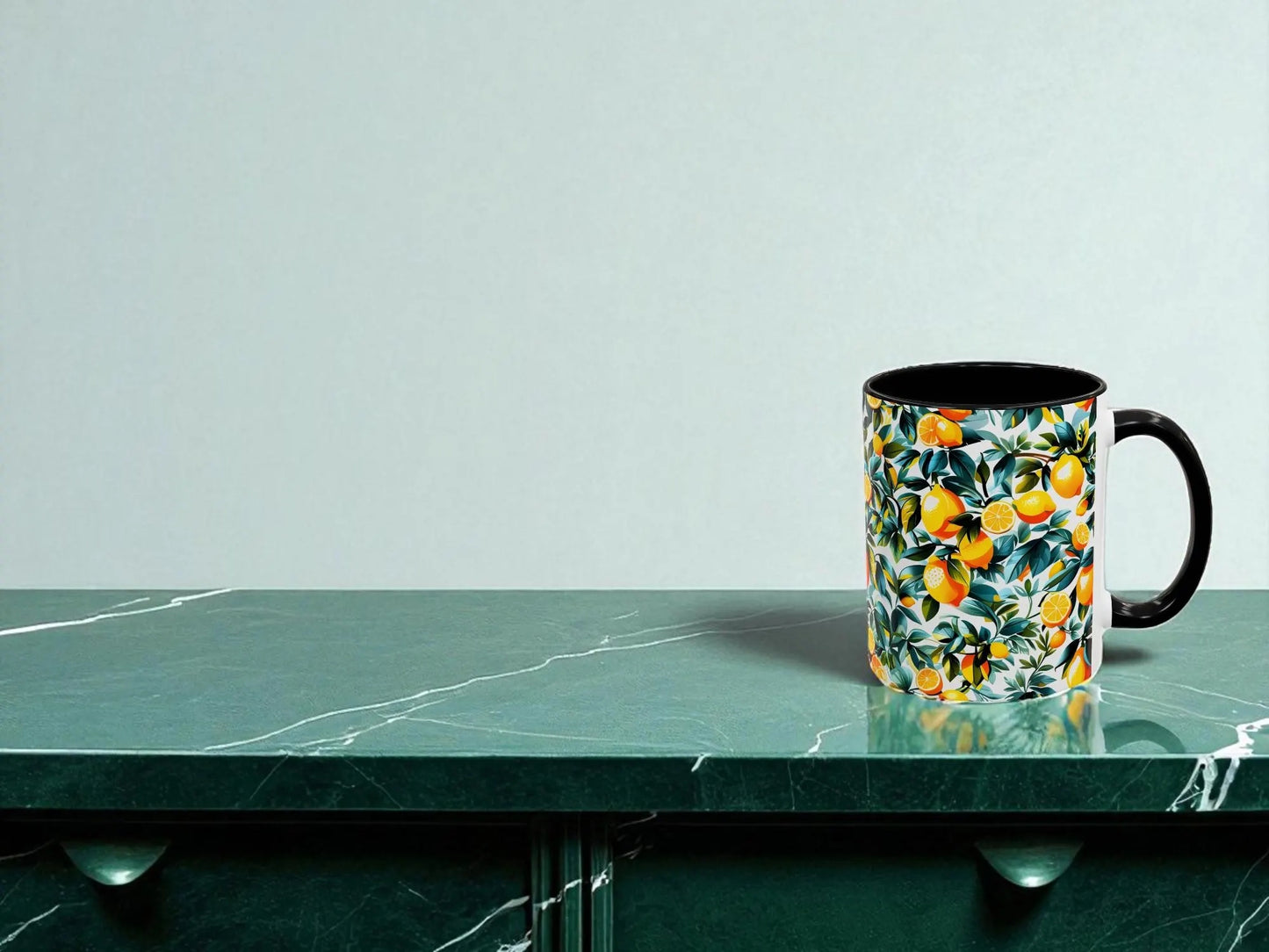 Floral-patterned mug on a green marble surface with a light gray background