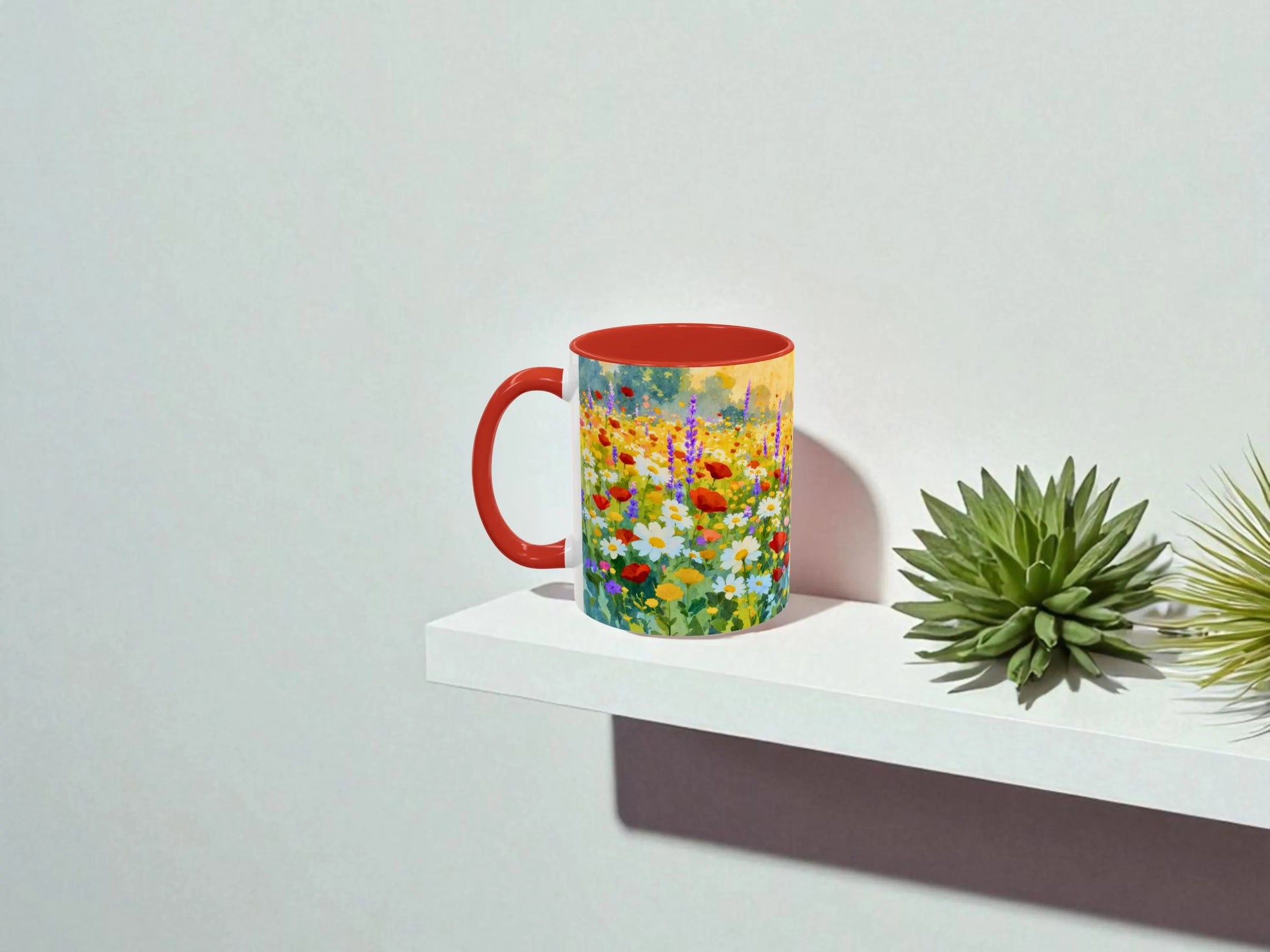Colorful mug with floral design on a white shelf against a light gray background