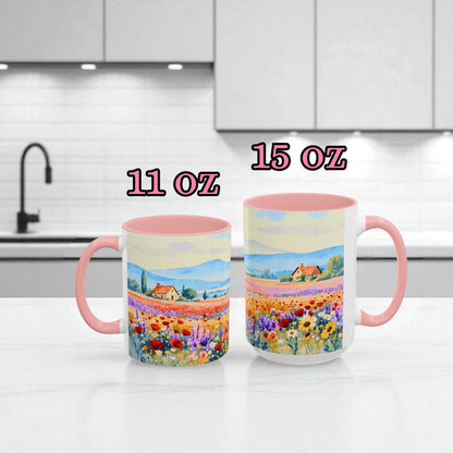 Two mugs with scenic designs on a kitchen counter, labeled 11 oz and 15 oz.