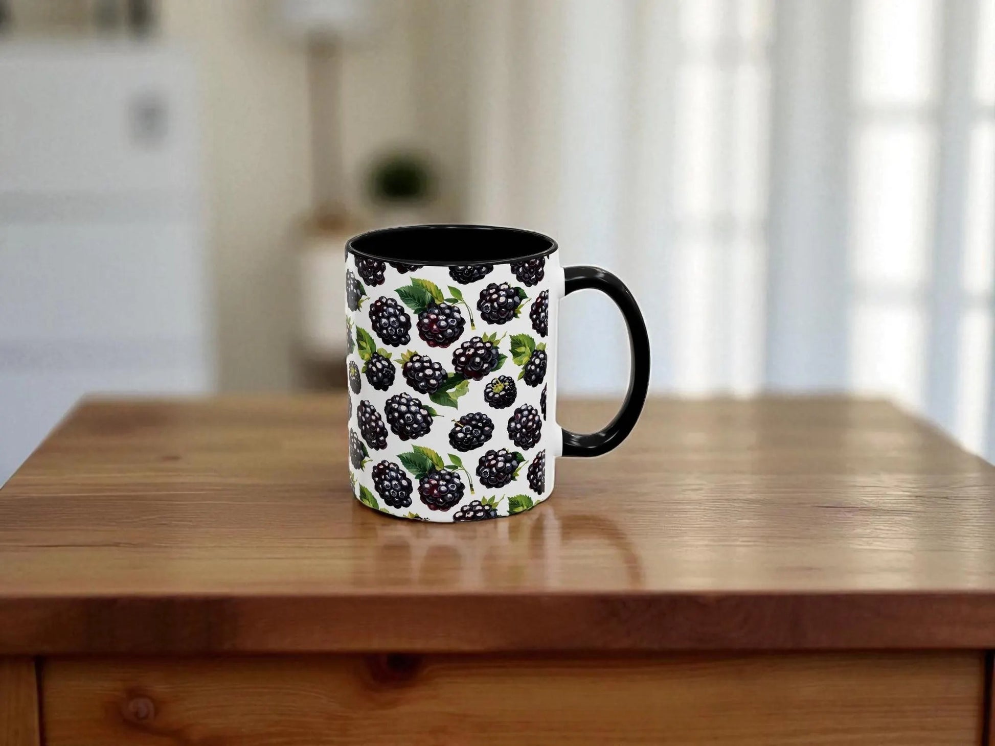 Blackberry-patterned mug on a wooden table with a blurred kitchen background