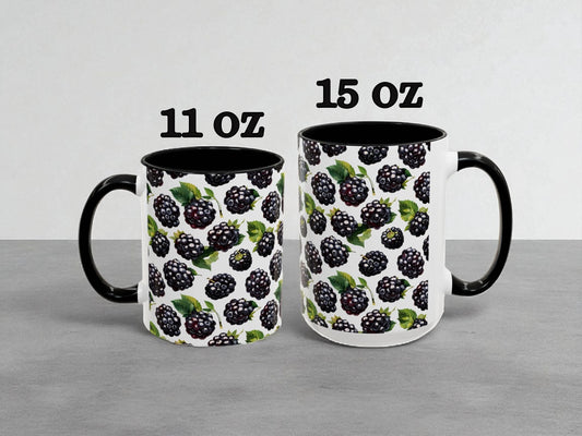 Two mugs with blackberry pattern, one labeled 11 oz and the other labeled 15 oz, on a gray background.