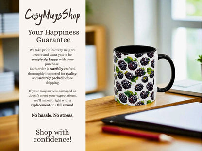 Mug with blackberry design on a desk with promotional text for 'Cosy Mugs Shop'.