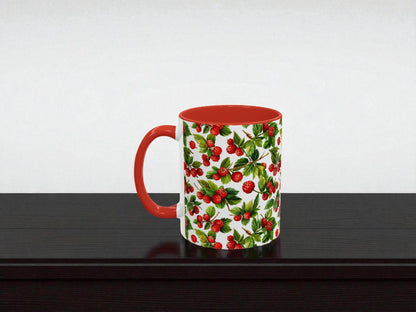 Mug with red handle and holly berry pattern on a white background