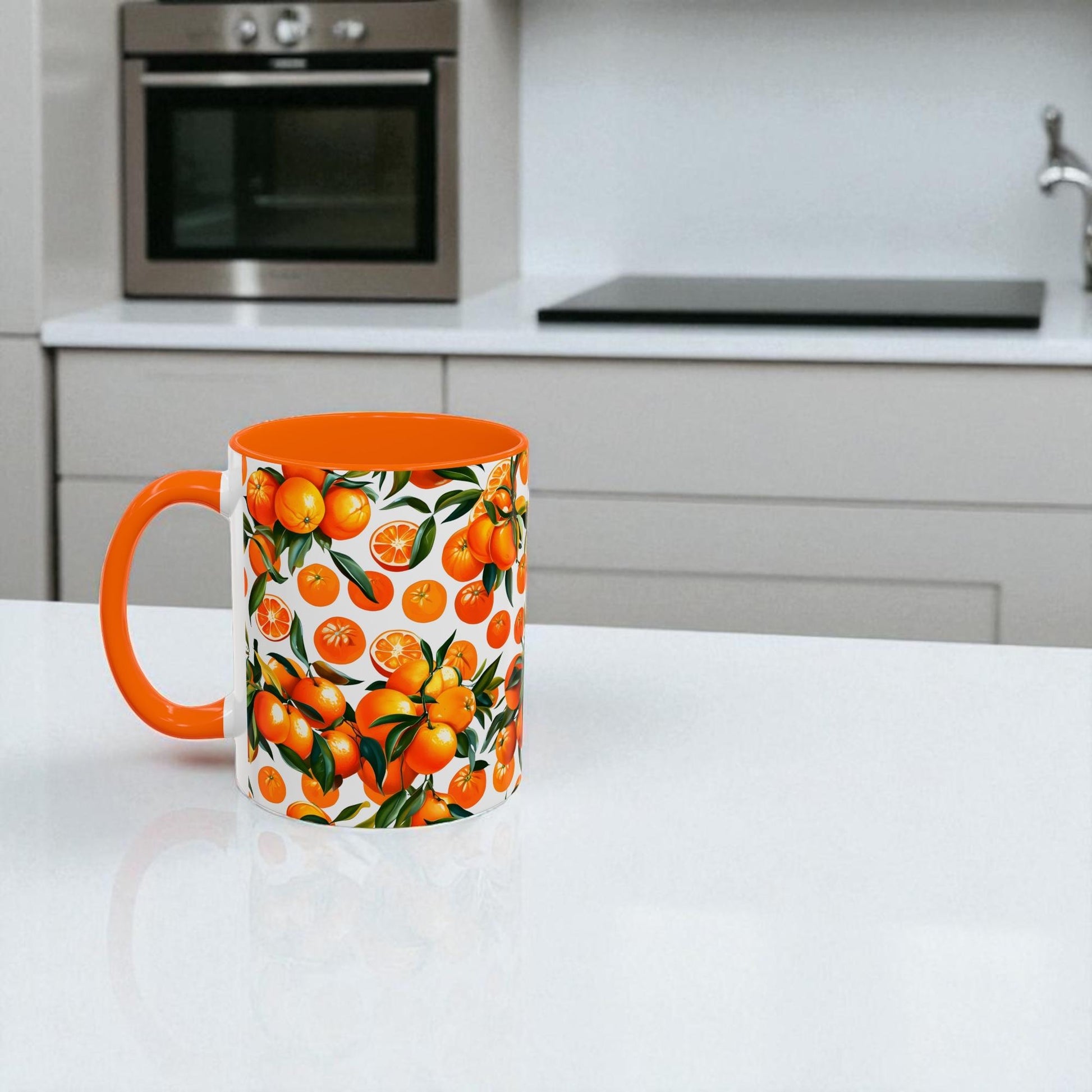 Mug with an orange design on a white surface with a plant