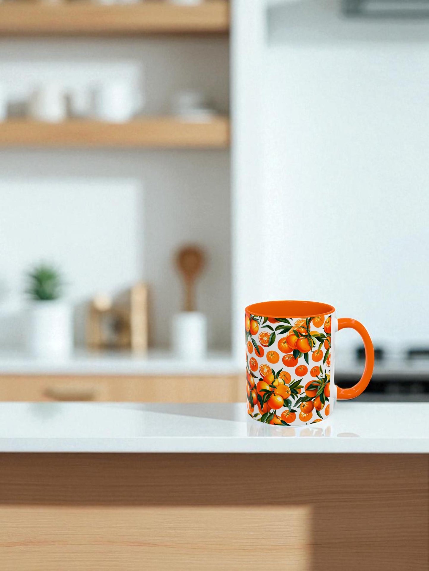 Orange mug with fruit design on a kitchen counter