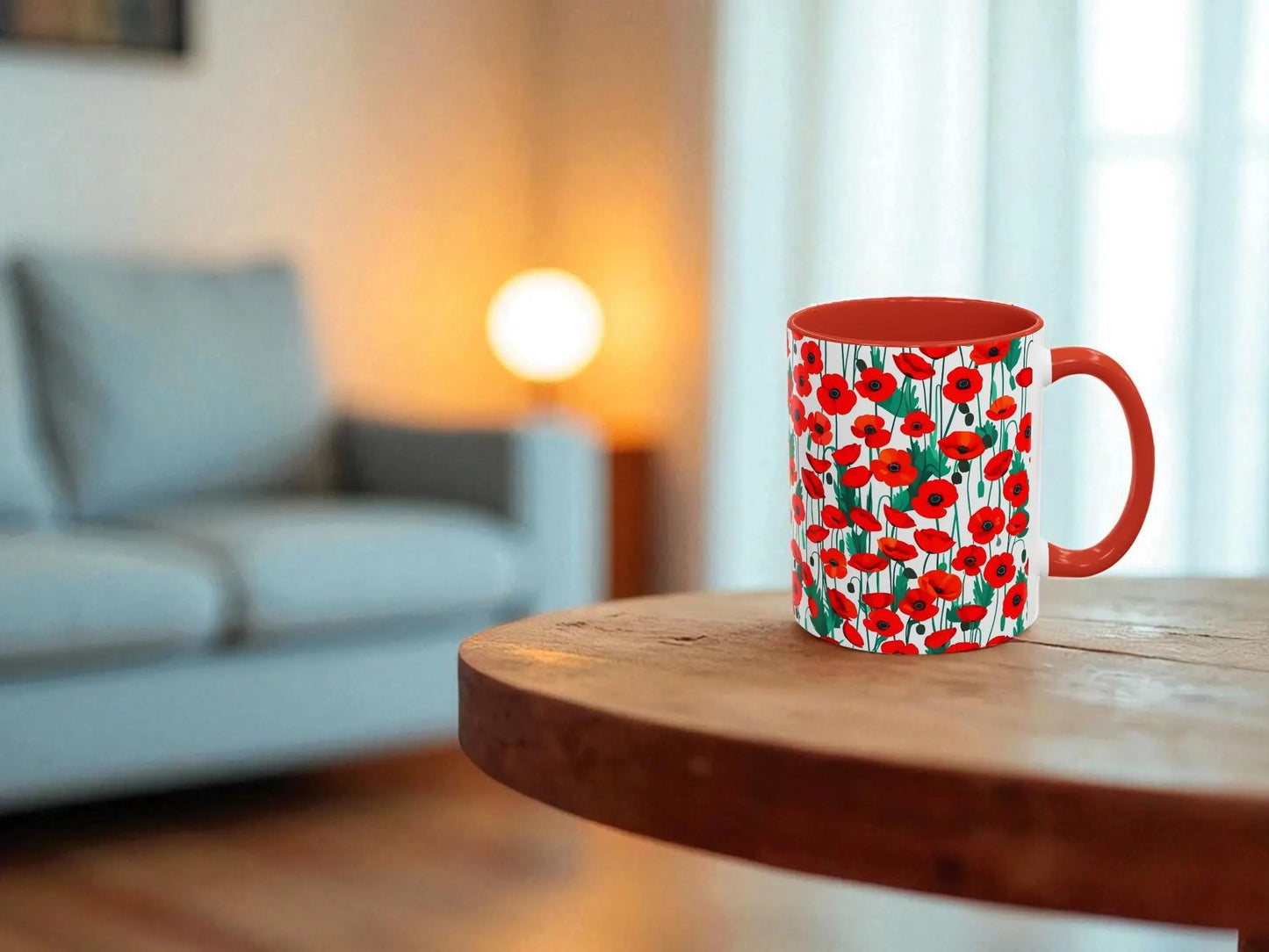 Mug with red floral pattern on a wooden table in a living room setting