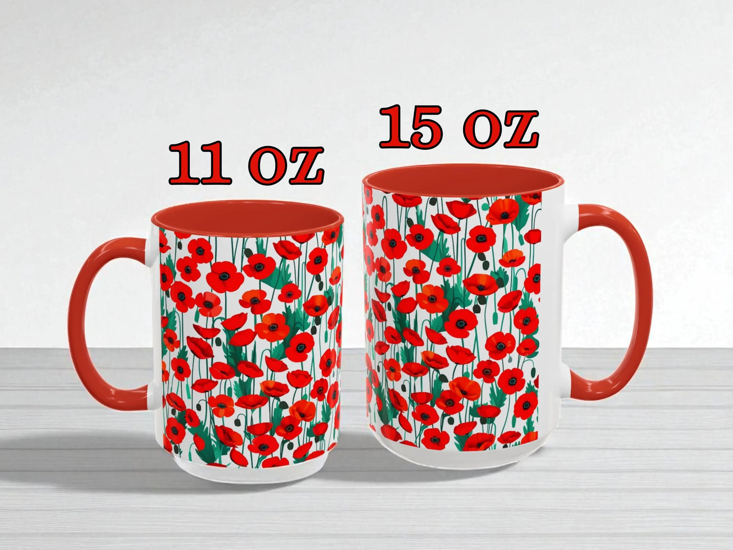 Two mugs with red poppy pattern, one 11 oz and one 15 oz, on a white background.