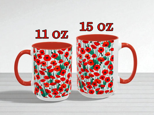 Two mugs with red poppy pattern, one 11 oz and one 15 oz, on a white background.