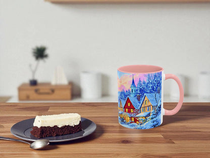 Mug with a scenic design on a wooden table next to a slice of cake.
