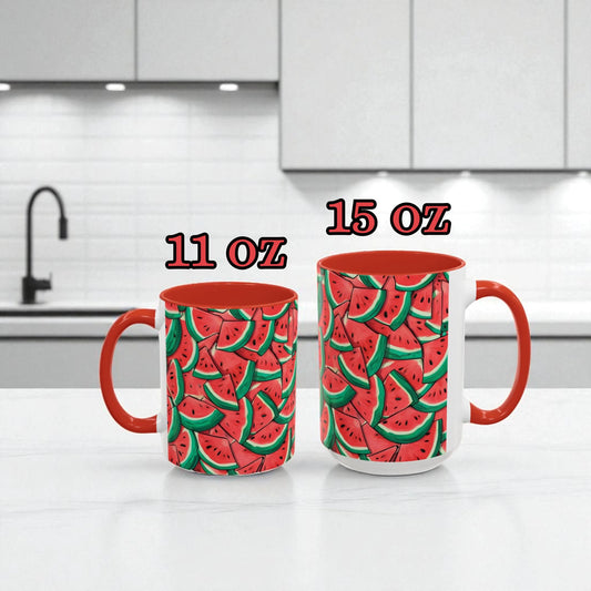 Two mugs with watermelon pattern on a kitchen counter, labeled 11 oz and 15 oz.