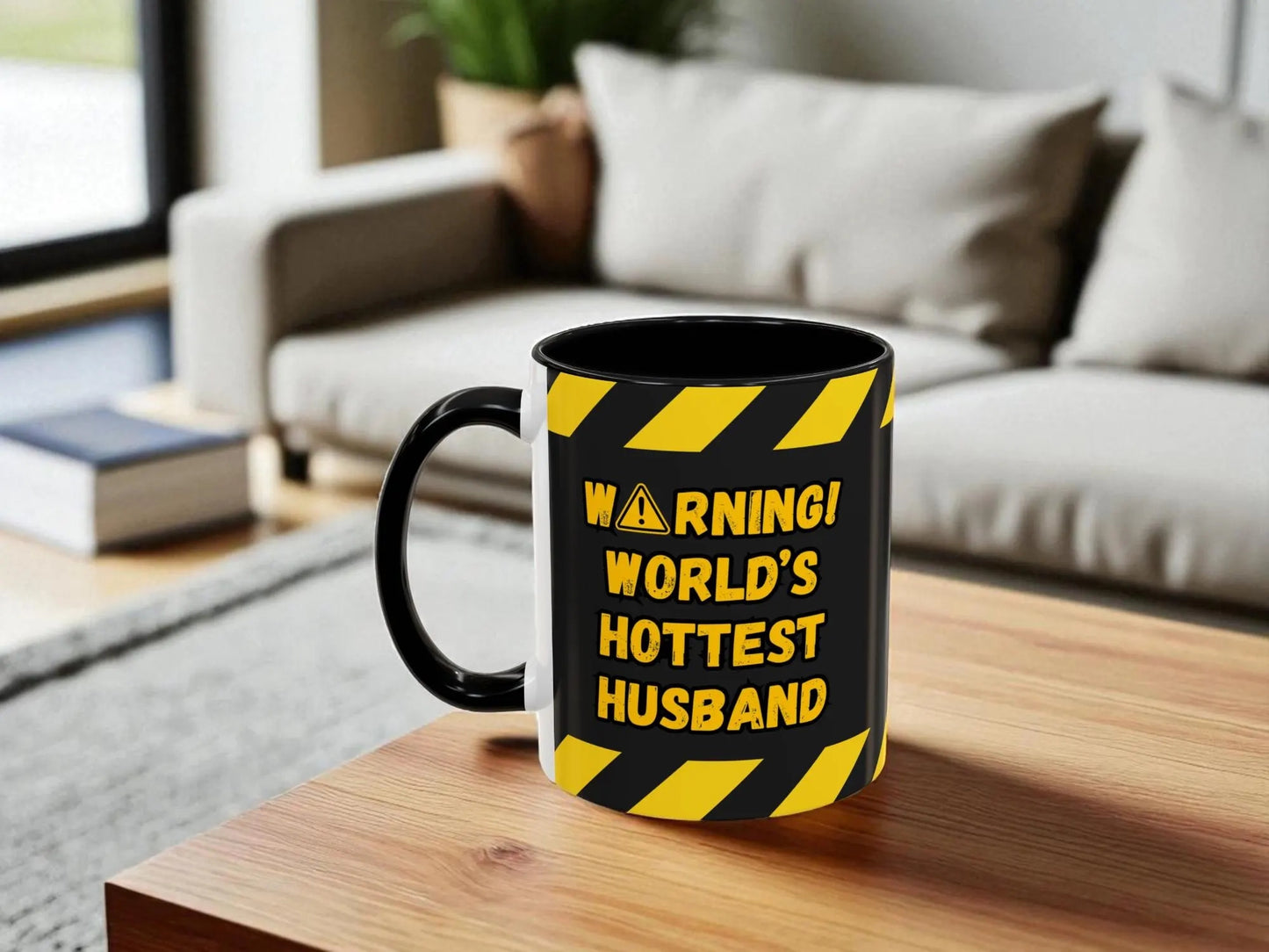 Mug with 'Warning: World's Hottest Husband' text on a wooden table in a living room setting.