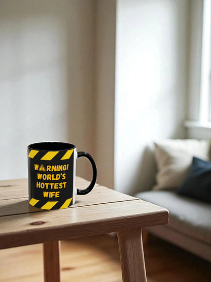 Mug with warning design on a wooden table in a living room