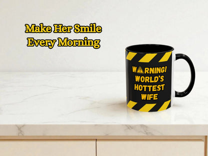 Black mug with yellow text on a white surface