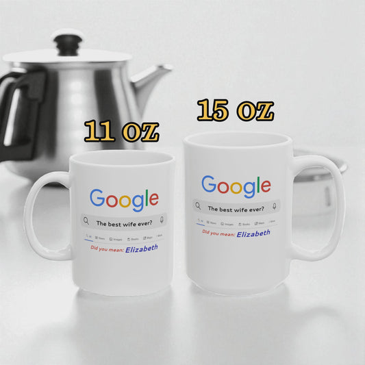 Two white mugs with Google search results printed on them, one labeled 11 oz and the other labeled 15 oz, next to a silver teapot.