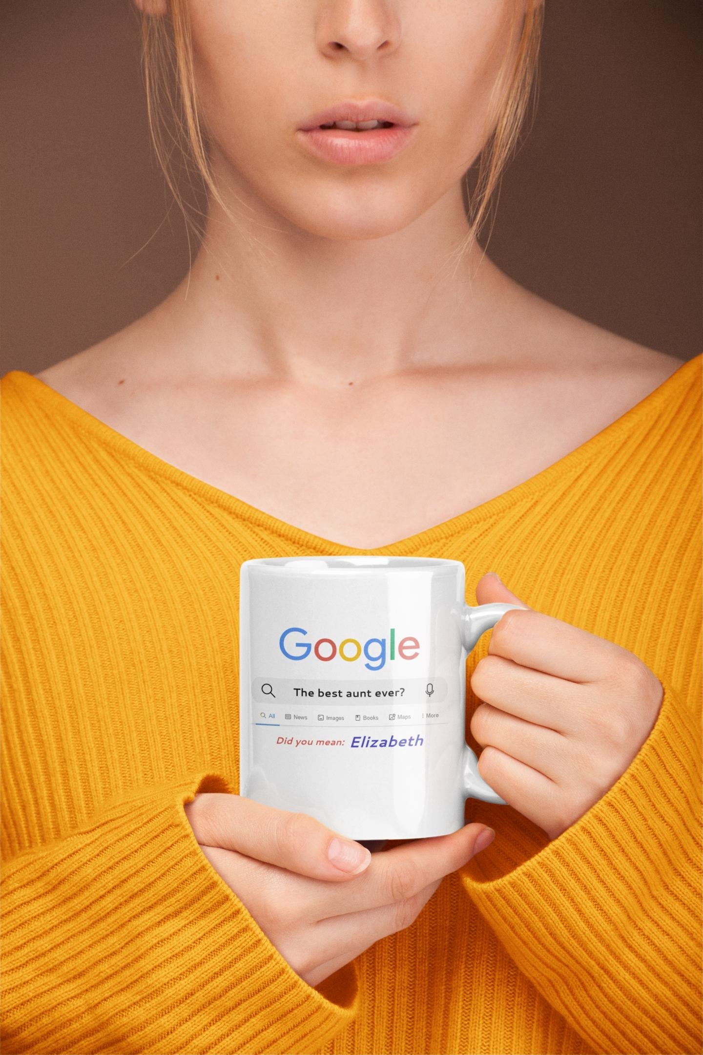Person holding a mug with Google logo and text against a brown background