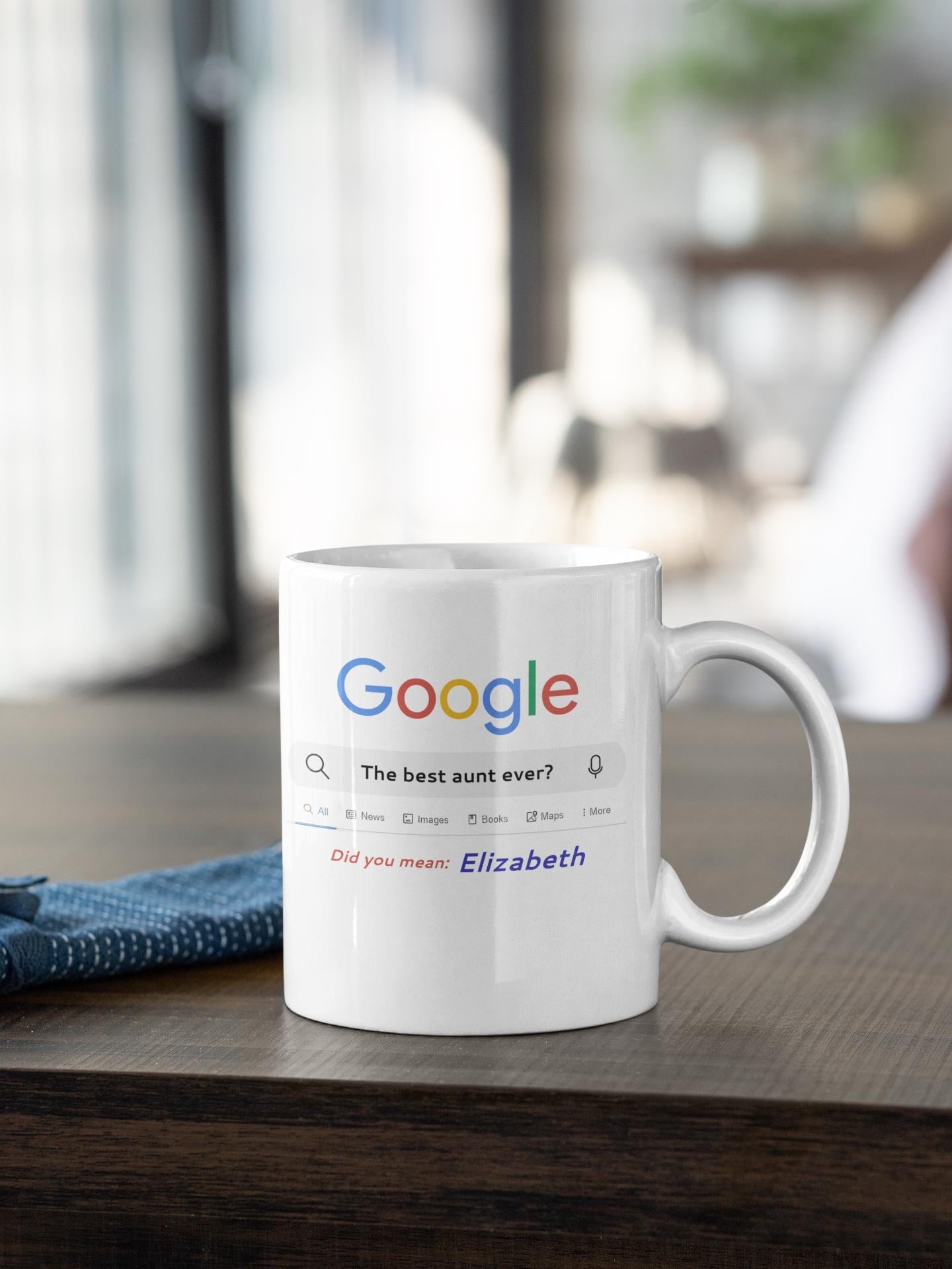 White mug with Google search query on a wooden surface