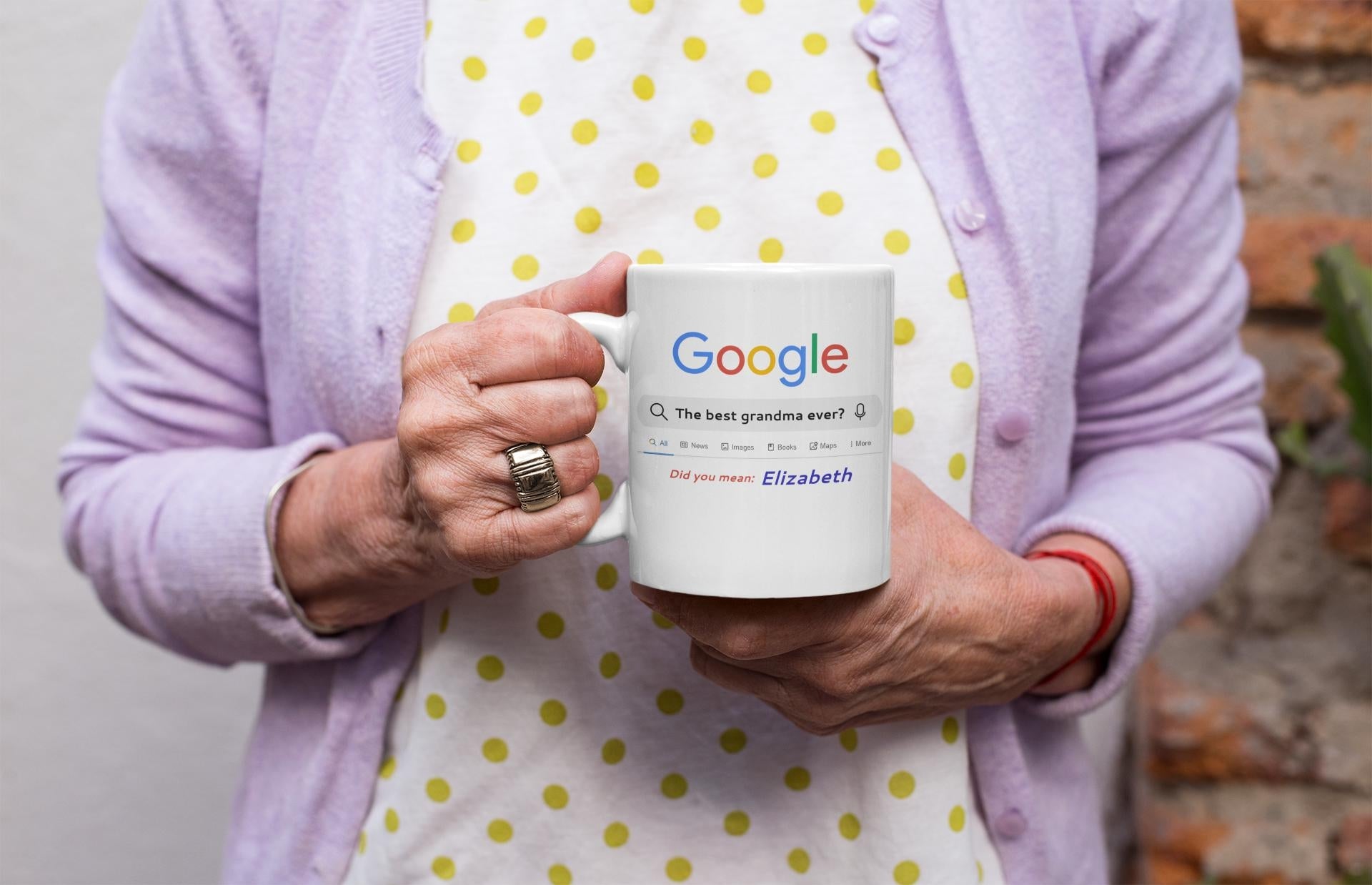 Person holding a mug with Google branding against a neutral background