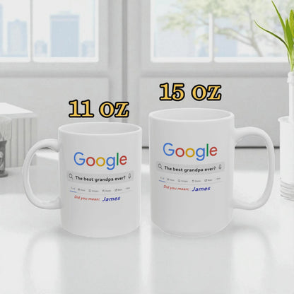 Two white mugs with Google search results printed on them, one labeled 11 oz and the other 15 oz, on a light surface.