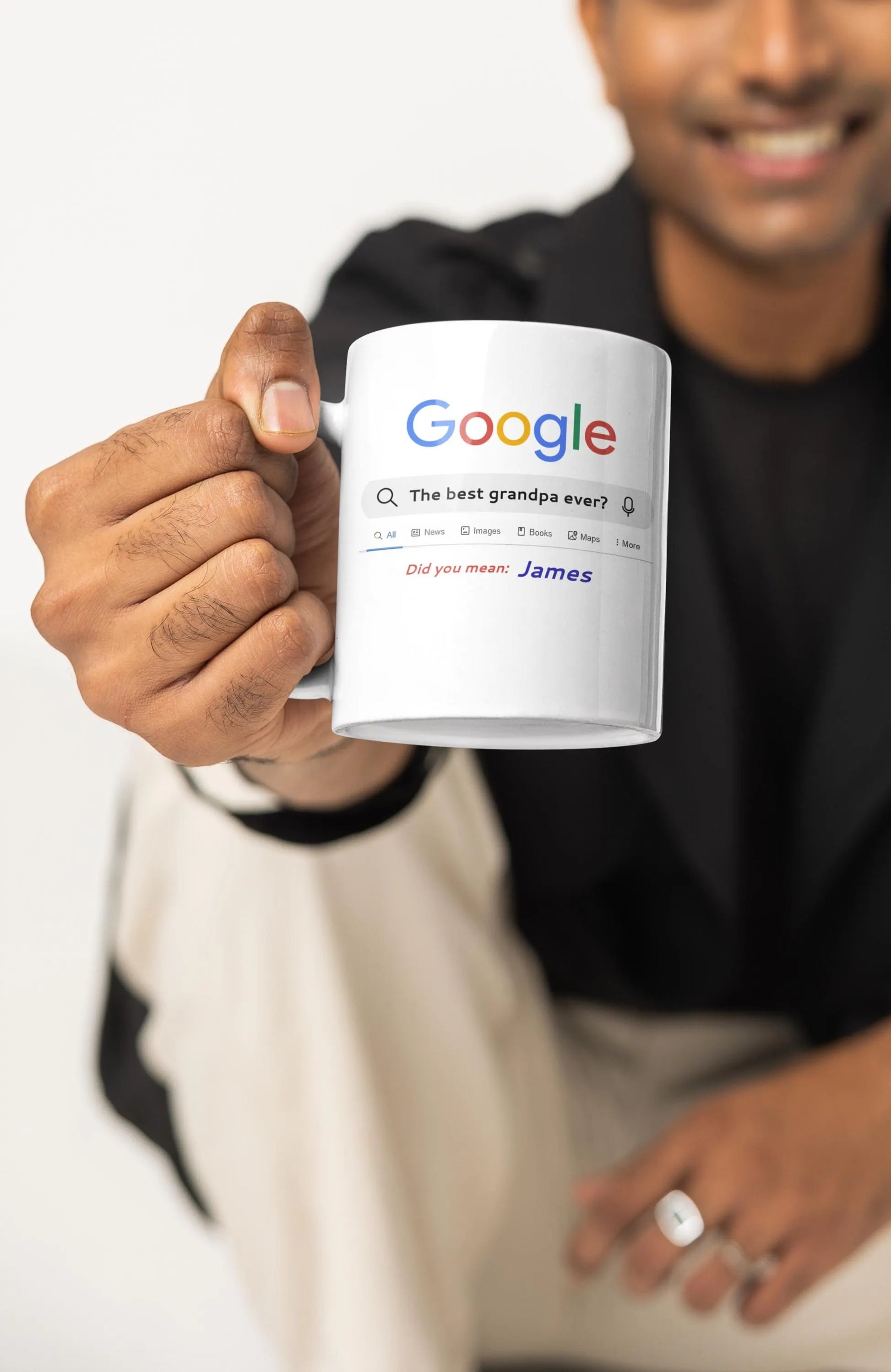 Person holding a mug with Google logo and text