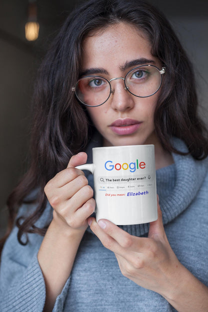 Person holding a mug with Google logo and text