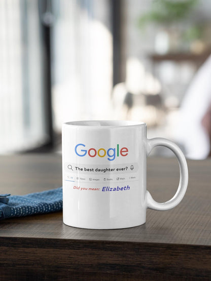 White mug with Google search query on a wooden surface