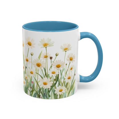 Mug with floral design and blue handle on a white background