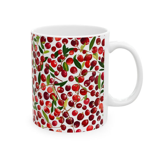 White mug with red cherry pattern on a white background