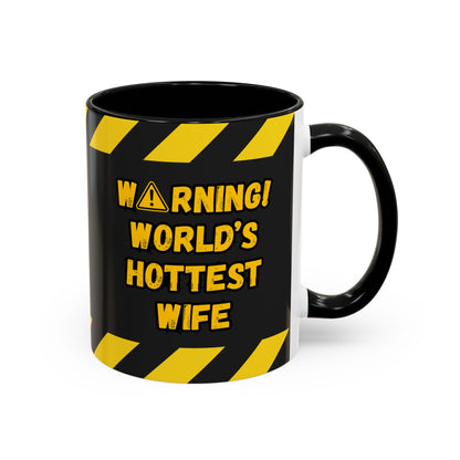 Black mug with yellow warning text on a white background